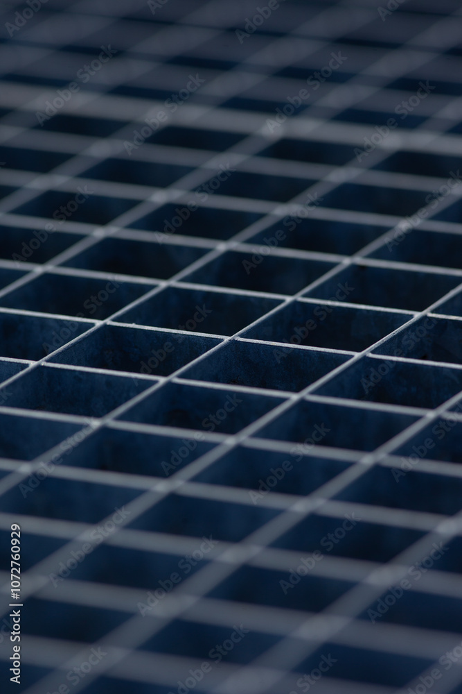 photo of a metal grill with square cells photo of a metal grill with square cells