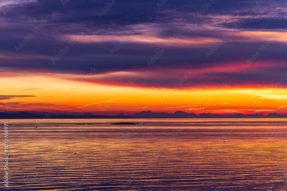 Stunning Sunrise Over Calm Ocean on Vancouver Island Beach Stunning Sunrise Over Calm Ocean on Vancouver Island Beach