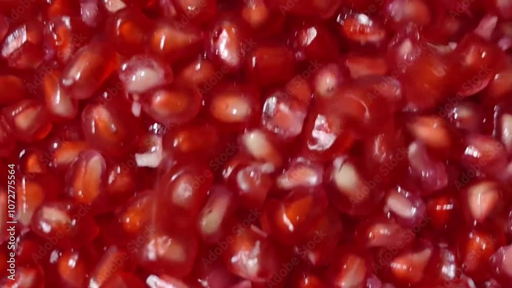 Pomegranate seeds are falling from above Pomegranate seeds are falling from above
