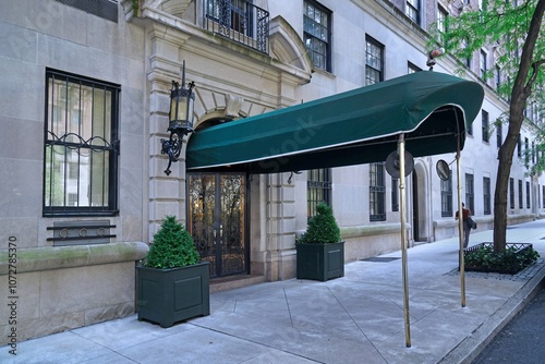 Photography Manhattan sidewalk with awning above entrance to apartment building