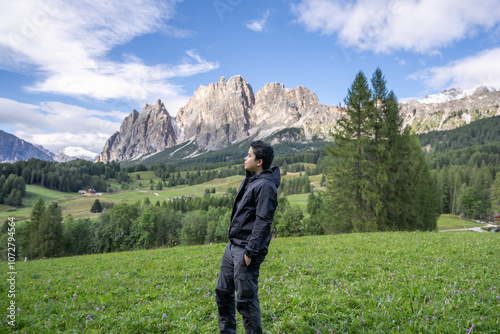 Man enjoy view of Cortina D Ampezzo mountains landscape Dolomites, Italy. photo