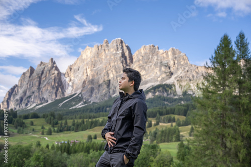 Man enjoy view of Cortina D Ampezzo mountains landscape Dolomites, Italy. photo