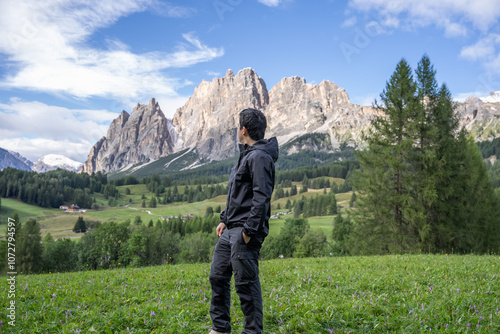 Man enjoy view of Cortina D Ampezzo mountains landscape Dolomites, Italy. photo