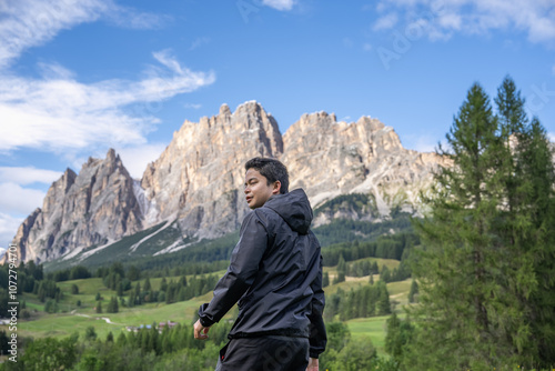 Man enjoy view of Cortina D Ampezzo mountains landscape Dolomites, Italy. photo