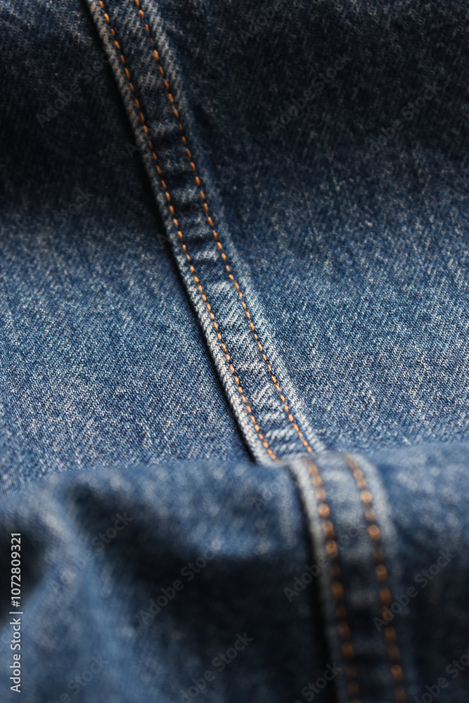 Fototapeta premium seam of blue denim texture background, jean fashion style
