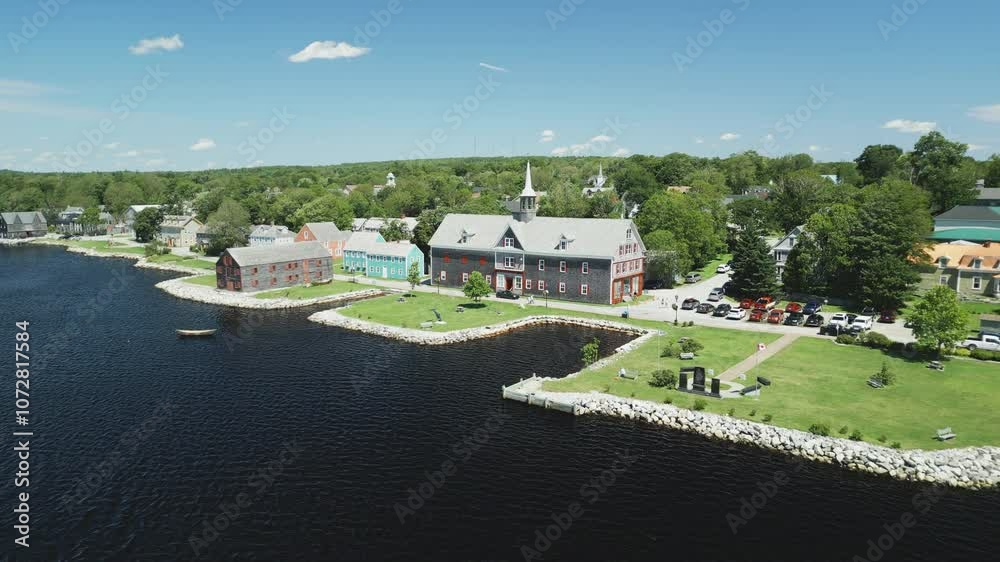 Aerial view of historic Shelburne harbour's Fishing Industry Tribute Memorial Park and Museums by The Sea, Nova Scotia, Canada.  MAX QUAL PRORES422HQ Transcode of 4K H.265 D-CINELIKE original capture.