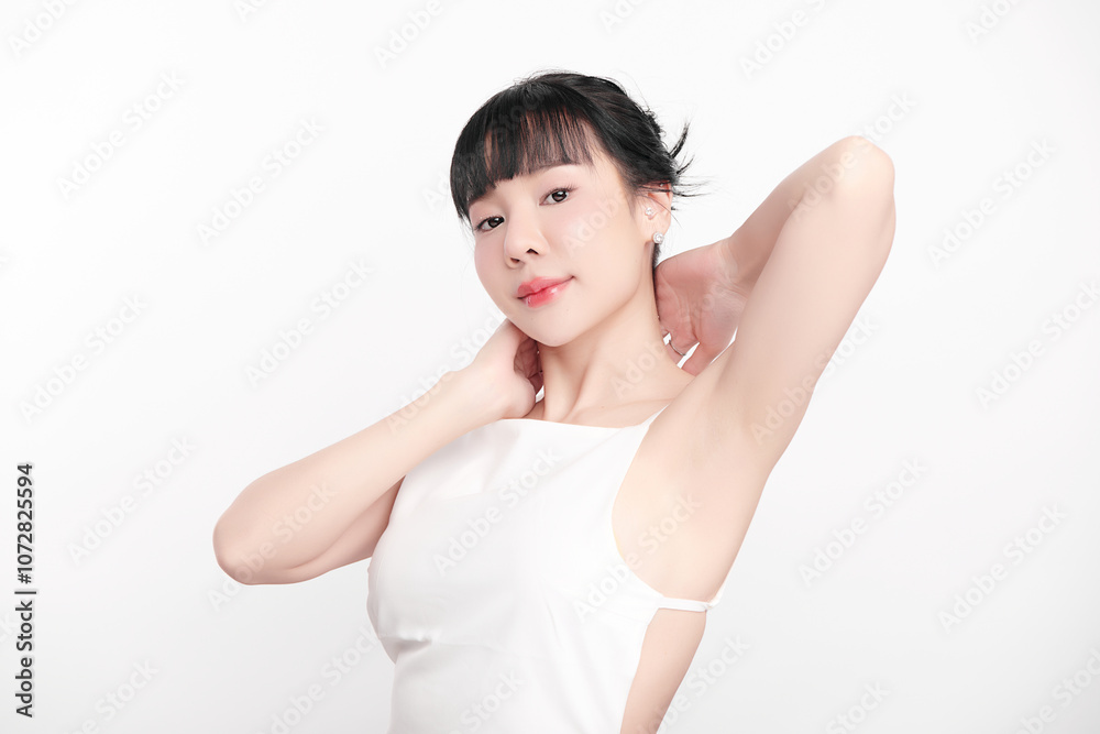 Beautiful Young Asian woman lifting hands up to show off clean and hygienic armpits or underarms on white background, Smooth armpit cleanliness and protection concept Beautiful Young Asian woman lifting hands up to show off clean and hygienic armpits or underarms on white background, Smooth armpit cleanliness and protection concept
