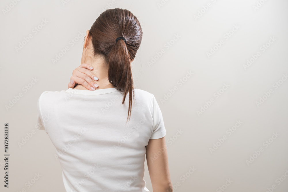 Pain body muscles stiff problem, asian young woman, girl painful with neck pain body ache from work, holding massaging rubbing shoulder hurt, sore on white background. Health care and medicine concept Pain body muscles stiff problem, asian young woman, girl painful with neck pain body ache from work, holding massaging rubbing shoulder hurt, sore on white background. Health care and medicine concept