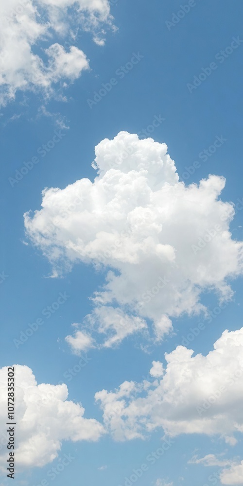 Fluffy white clouds floating against a clear blue sky, nature, beautiful Fluffy white clouds floating against a clear blue sky, nature, beautiful