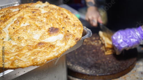 Green onion pancakes sold at stalls in Taiwan's night market photo