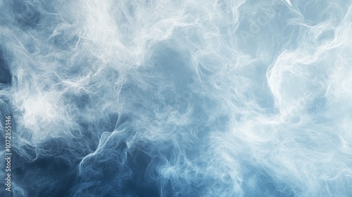 A soft, misty abstract background with light blue and white wisps of cloud-like forms creating a tranquil, serene effect.