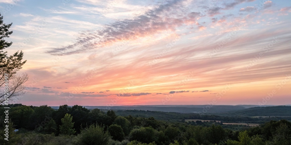 Obraz premium Watercolor brushstrokes create a soft, ombre-effect in the sky as the sun dips below the horizon, soft, background