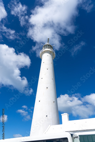 Gibbs Hill Lighthouse stands tall on Bermuda Island under a blue sky photo