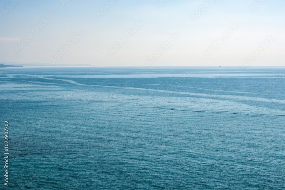 Fototapeta premium Vast open water with a subtle gradient of blues, wave patterns, serene ambiance, expansive horizons, underwater world, aquatic life