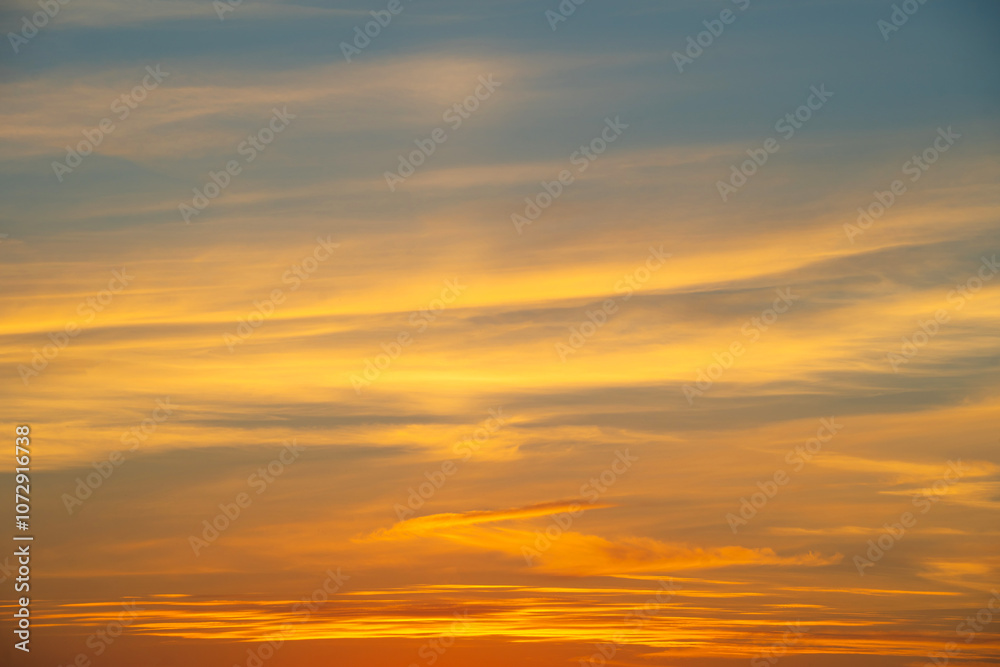 Fototapeta premium summer evening, sunset in yellow, orange and pink with clouds, background