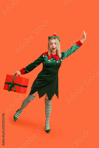 Excited young woman in elf ...