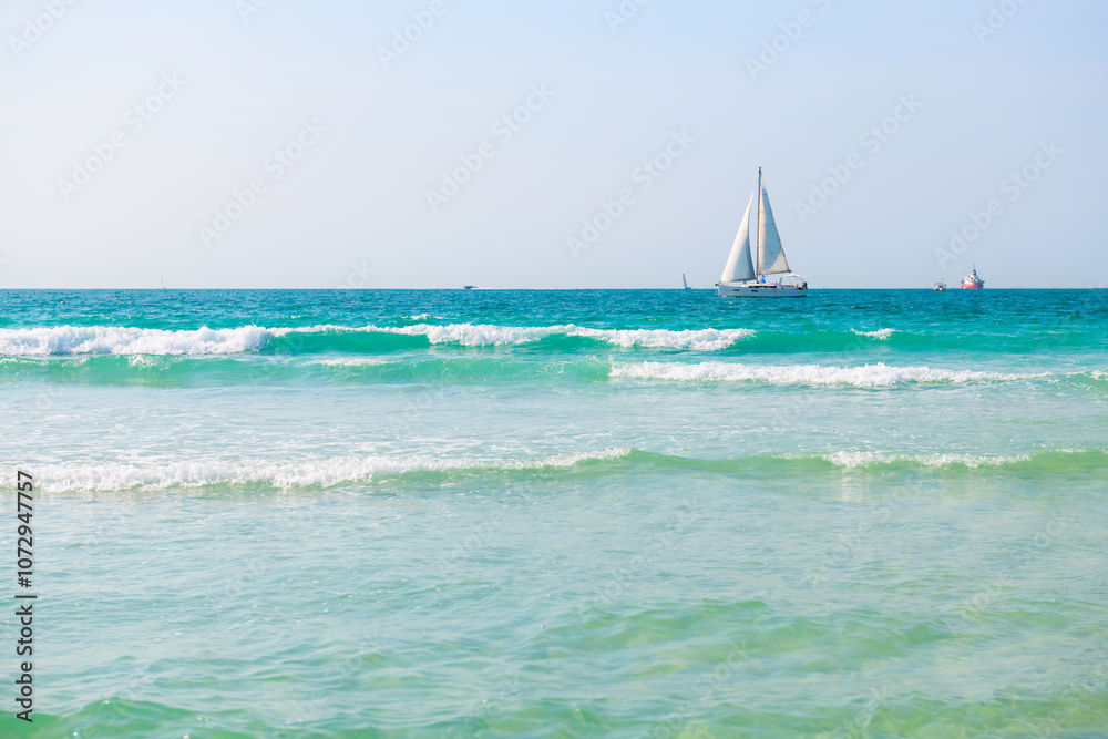 Obraz premium Beautiful beach with turquoise clear water. Dubai, United Arab Emirates.