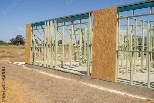 The bare wooden building frame of a house under construction.