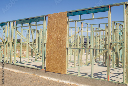 The bare wooden building frame of a house under construction.