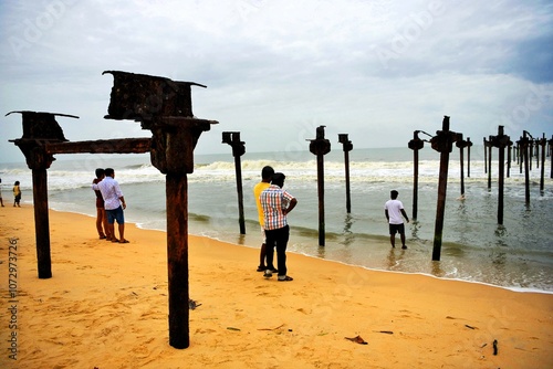 Photography People seeing old rusted damaged pier, Alappuzha Beach, Alappuzha, Alleppey, Ker