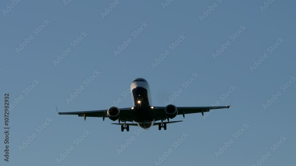 Modern Large Plane Flies Overhead on a Beautiful Blue Sky Modern Large Plane Flies Overhead on a Beautiful Blue Sky