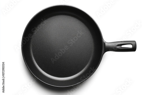 Black frying pan isolated on white. This image is ideal for use in cooking-related designs, recipe websites, or advertisements for cookware.