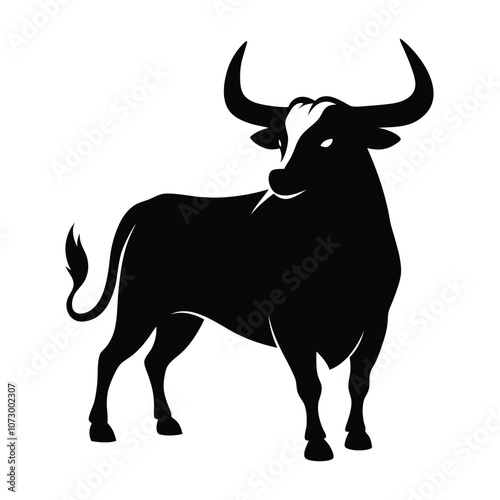 a angry bull. The bull is standing on all fours and is facing towards silhouette