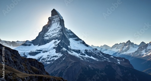 Majestic peak of the Matterhorn in Switzerland, framed by snow-covered slopes and blue skies, with natural light highlighting its iconic, sharp silhouette.