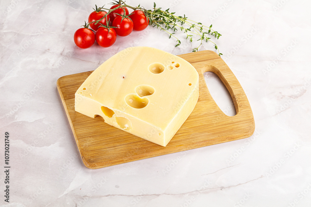 Maasdam cheese brick over board Maasdam cheese brick over board