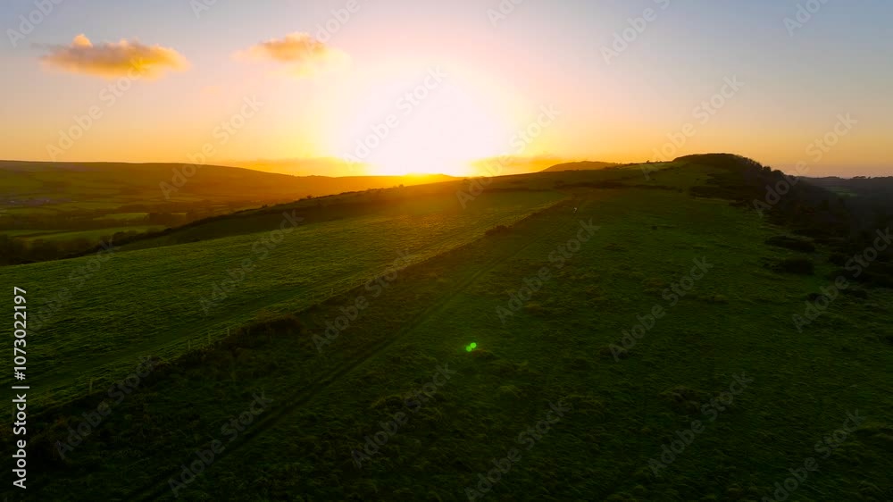 Aerial sunset view of Corfe Castle, a village and civil parish in the English county of Dorset, UK Aerial sunset view of Corfe Castle, a village and civil parish in the English county of Dorset, UK