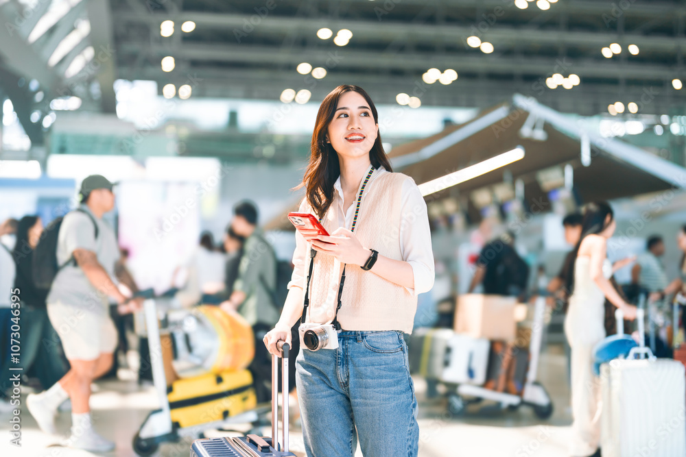 Portrait of standing tourist woman passenger at international airport terminal for holidays travel Portrait of standing tourist woman passenger at international airport terminal for holidays travel
