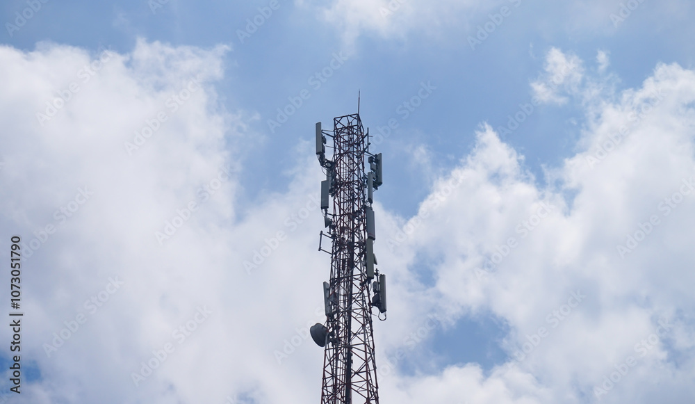 Transmitter tower with blue sky and clouds background Transmitter tower with blue sky and clouds background