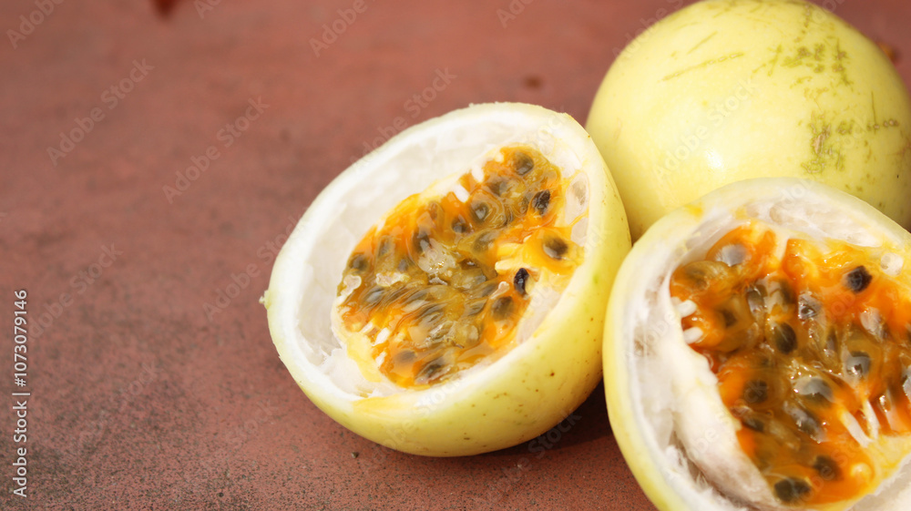 Fresh Passion Fruit Halves Showing Seeds and Vibrant Pulp – High-Quality Close-Up Image with copy space Fresh Passion Fruit Halves Showing Seeds and Vibrant Pulp – High-Quality Close-Up Image with copy space