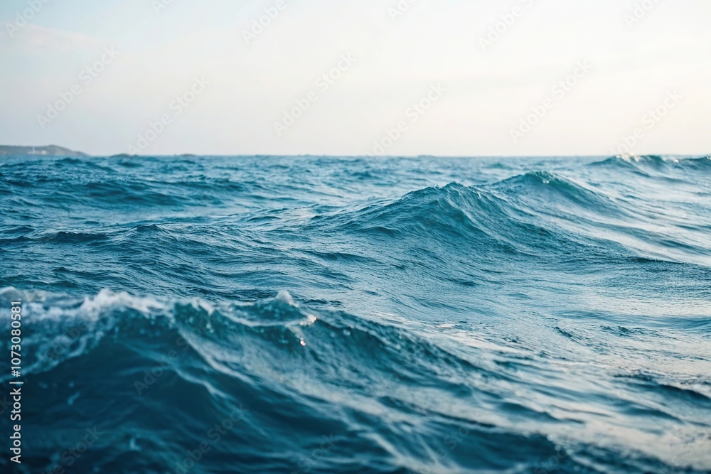 Fototapeta premium Soft abstract blue sea waves gently flowing, wavy patterns, serene landscape, blue ocean background