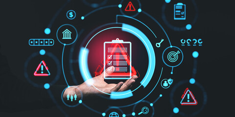 Hand holding digital icons for risk management and assessment on a dark background, symbolizing business strategy and control