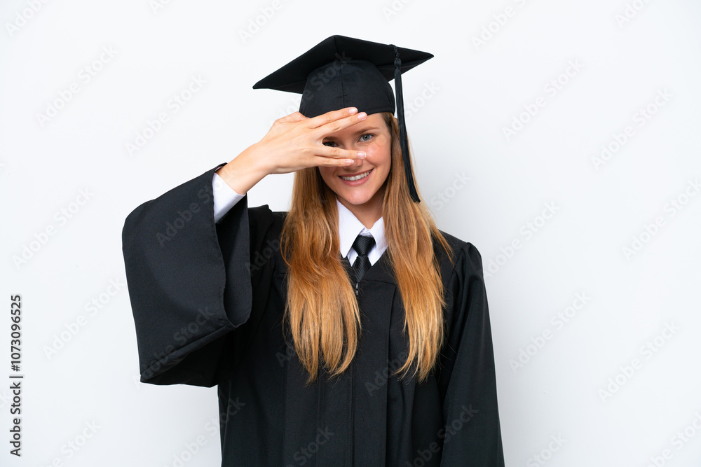 Young university graduate caucasian woman isolated on white background covering eyes by hands and smiling