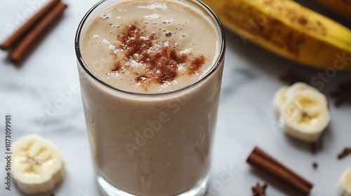 Creamy Banana and Cinnamon Smoothie Served in a Clear Glass with Minimal Background