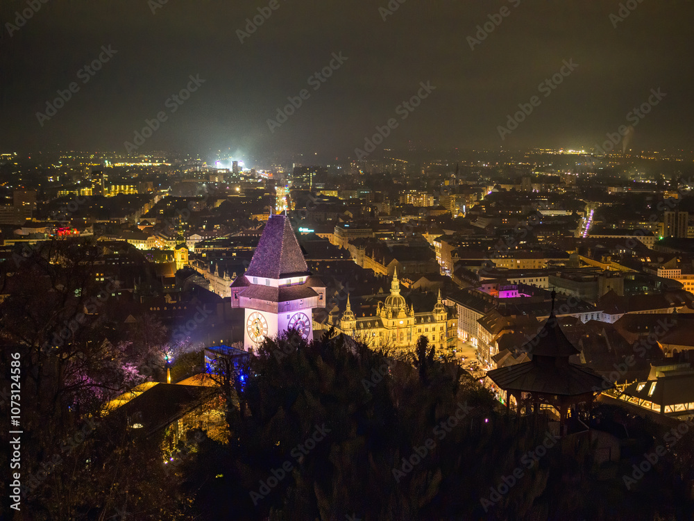 Obraz premium High Angle View Of Illuminated Cityscape Against Sky At Night, Graz, Austria