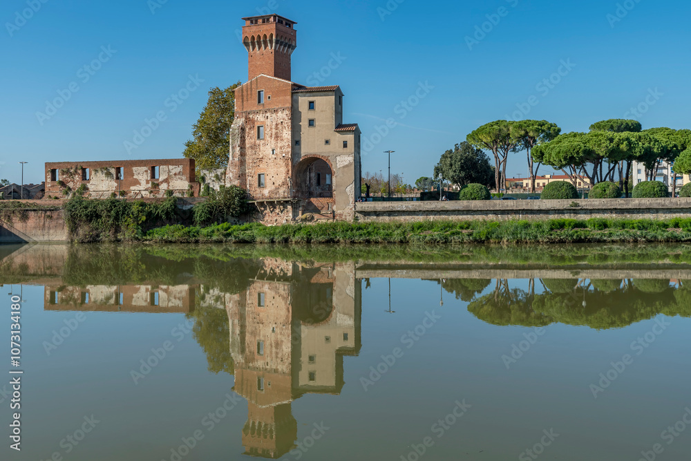 Ancient Citadel of Pisa, Italy, reflected in the water of the Arno River Ancient Citadel of Pisa, Italy, reflected in the water of the Arno River