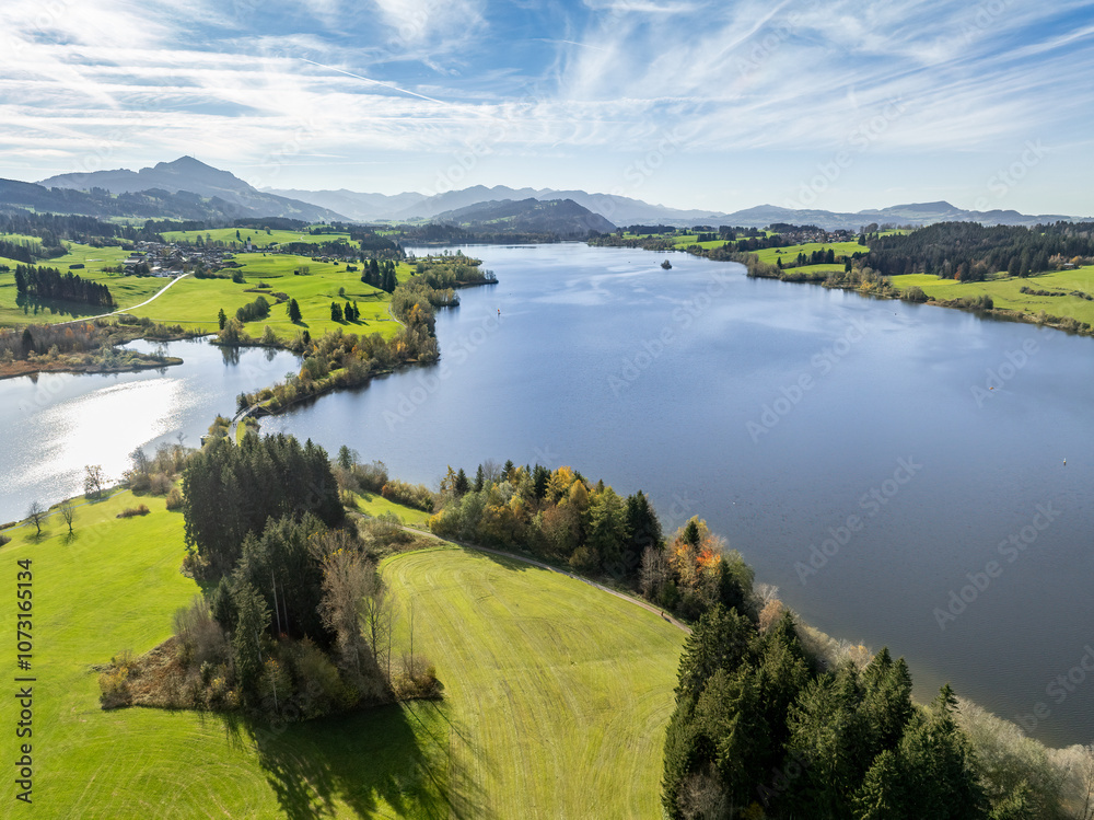 Naklejka premium aerial landscape photo of with Lake Rottachspeicher between pastures and colorful autumn forests in the upper Allgaeu in Petersthal, next to Kempten Kempten