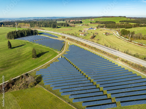 aerial view of a huge photovoltaik power plant next to a highway in southern Germany