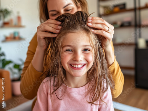 Mother Drying Daughter's Hair at Home in Cozy Setting