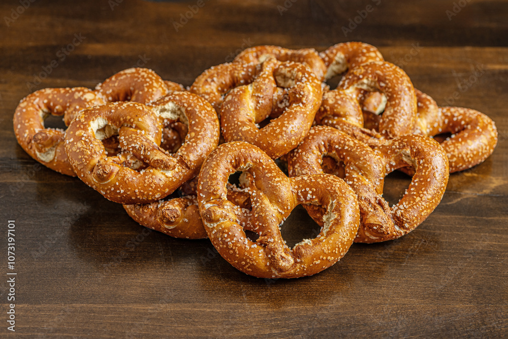 fresh crispy pretzels on a wooden surface close up shallow depth of field fresh crispy pretzels on a wooden surface close up shallow depth of field