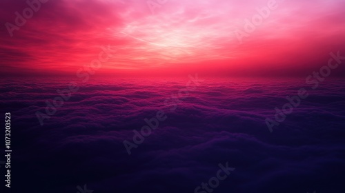 A breathtaking sunset over a sea of clouds, painted in shades of pink, purple, and deep blue.