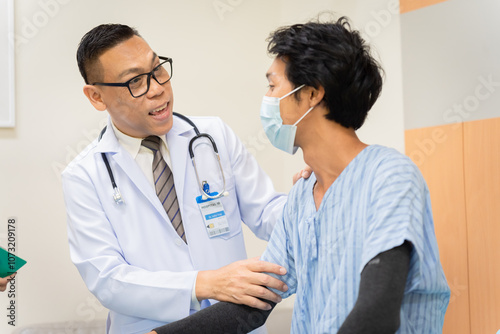 Asian health care professional conducts a medical yearly checkup examination, patient male lie down for observations, patient care services with specialist doctor using a stethoscope in clinic