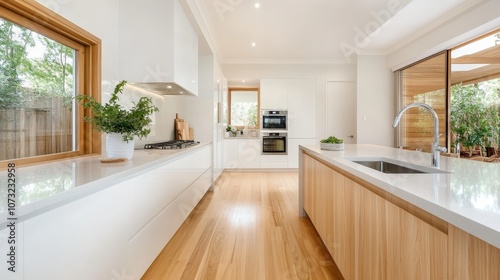 A bright kitchen featuring wooden elements, modern appliances, and lush greenery. Plenty of natural light provides a serene and harmonious cooking space.