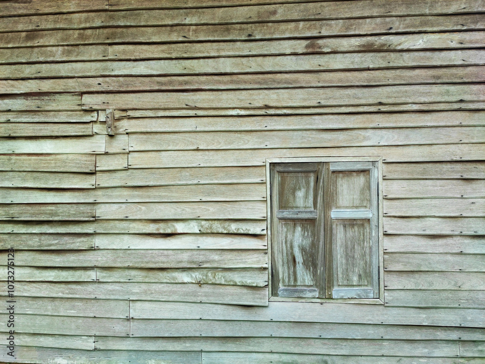 The brown wood texture wall and window of the old style house. The brown wood texture wall and window of the old style house.
