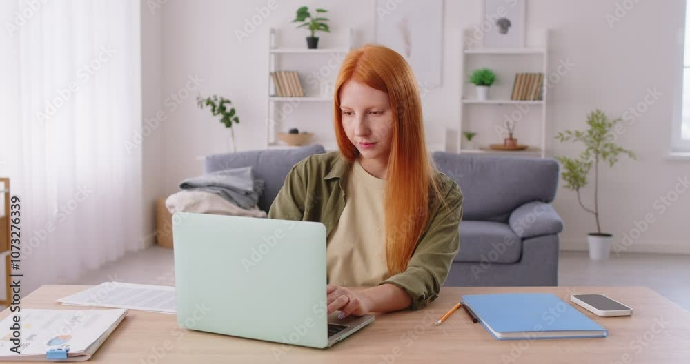 Freelancer or student works or studies online using a laptop in a home office. Remote work or online learning, highlighting the use of technology and computer in a domestic business environment. Freelancer or student works or studies online using a laptop in a home office. Remote work or online learning, highlighting the use of technology and computer in a domestic business environment.