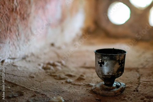 Antique metal chalice on a window in the ruins of Himara Castle, Albania