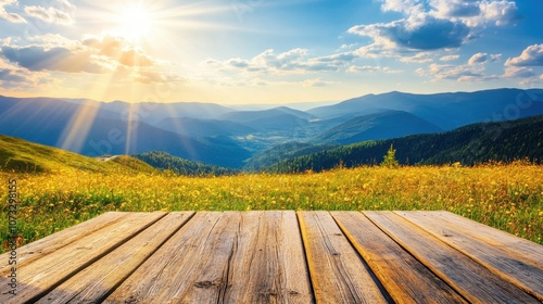 Empty wooden table on grassy hilltop, mountains and valleys extending into the distance under sunlight